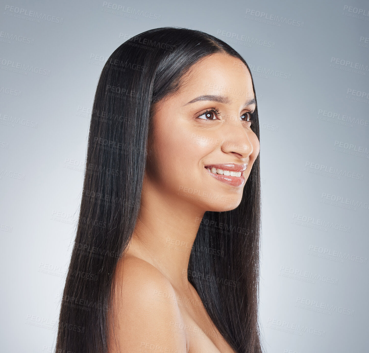 Buy stock photo Shot of an attractive young woman standing alone and posing in the studio