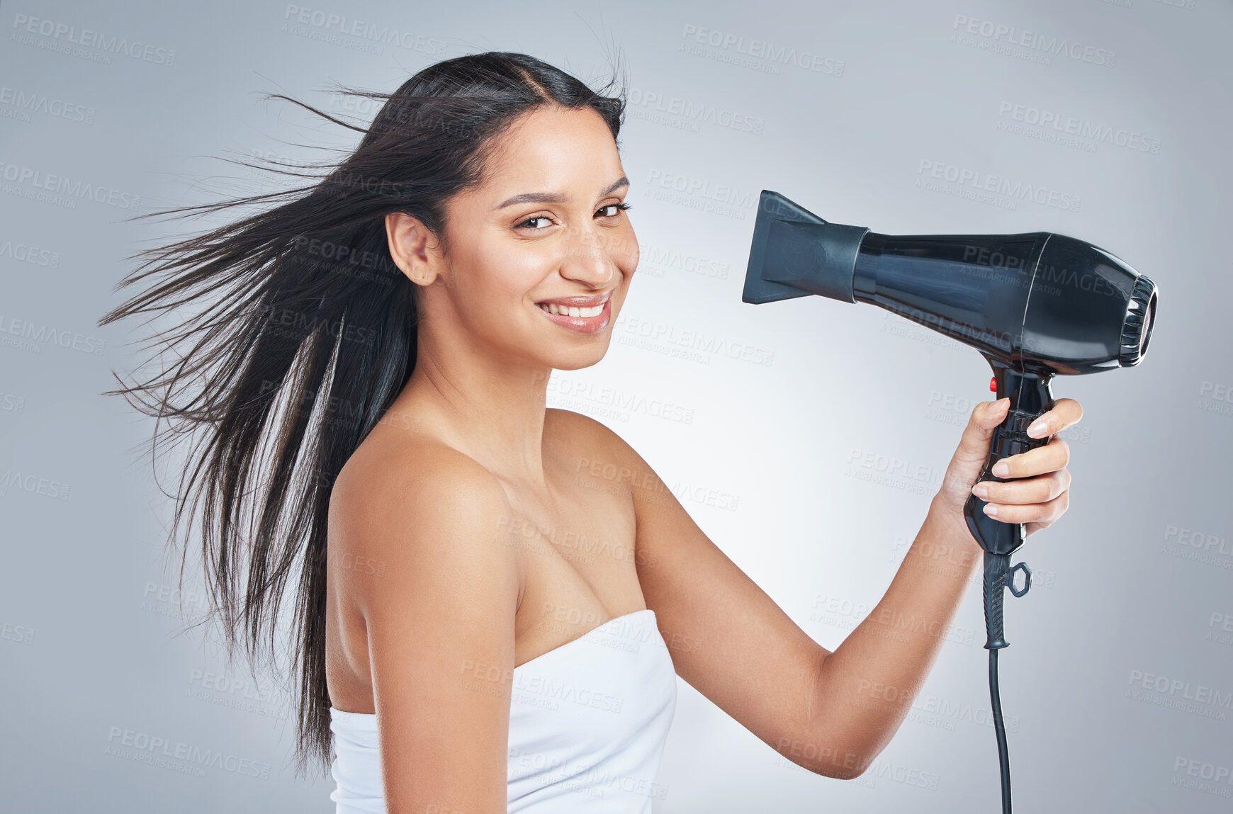 Buy stock photo Hair, portrait and woman with hairdryer in studio for cosmetic, shine or heat protectant promo on grey background. Haircare, beauty or face of girl model with hot air tool for smooth, glow or results