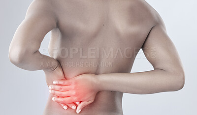 Buy stock photo Rearview shot of a woman experiencing back pain