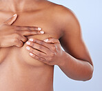 How do you perform a breast self-examination?