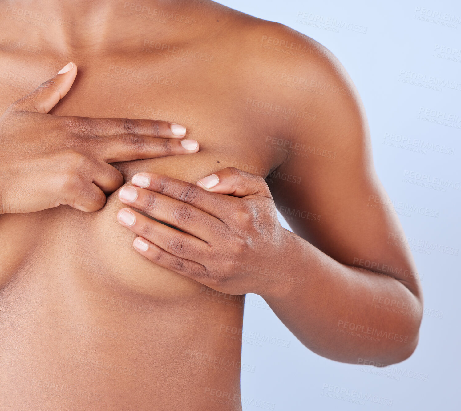 Buy stock photo Studio shot of an unrecognisable woman examining her breast