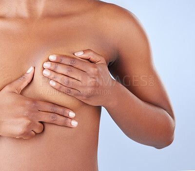 Buy stock photo Studio shot of an unrecognisable woman examining her breast