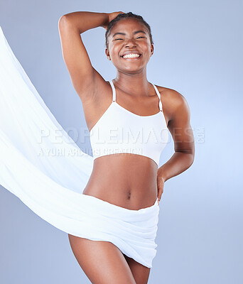 Buy stock photo Shot of a fit young woman posing against a blue background