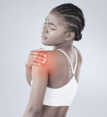 Buy stock photo Rearview shot of a woman experiencing shoulder pain