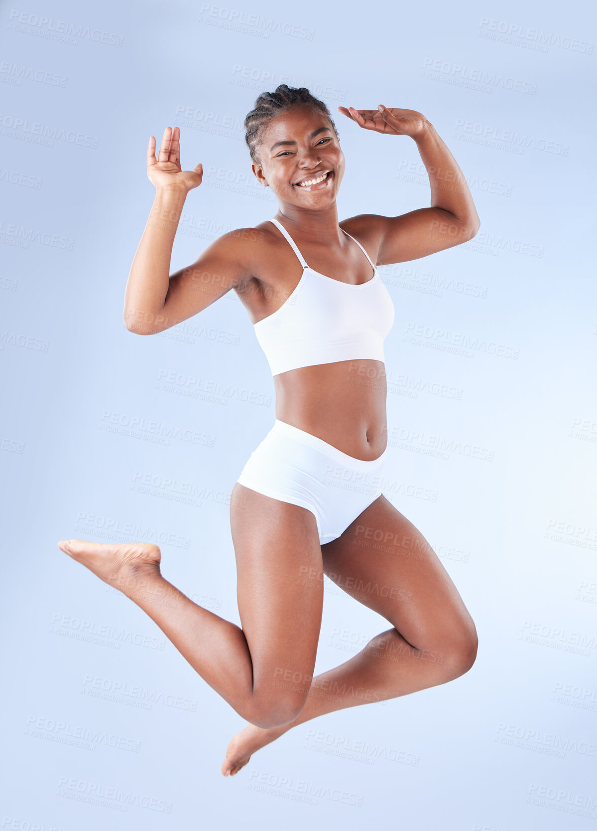 Buy stock photo Happy, portrait and black woman in lingerie jump in studio for body positivity, freedom and acceptance on blue background. Smile, energy and excited African model with wellness, beauty or self esteem