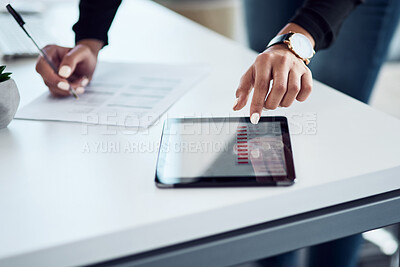 Buy stock photo Closeup shot of an unrecognisable businesswoman writing notes while using a digital tablet in an office