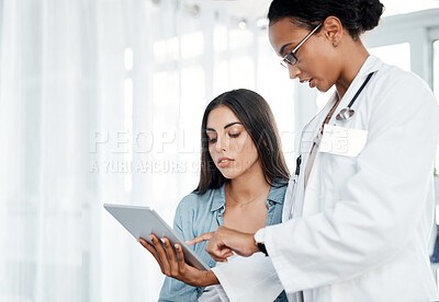 Buy stock photo Shot of a doctor discussing a patients results with her