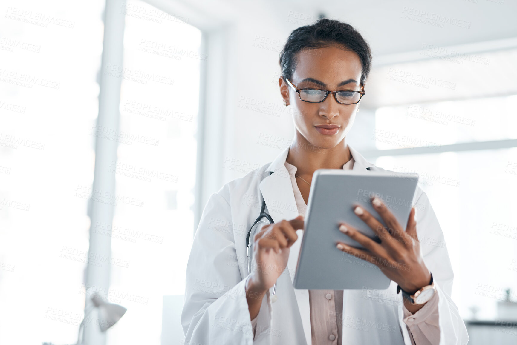 Buy stock photo Doctor, healthcare and woman reading on tablet for research, information and hospital update. Digital technology, medical professional and check schedule, report or results for telehealth on internet