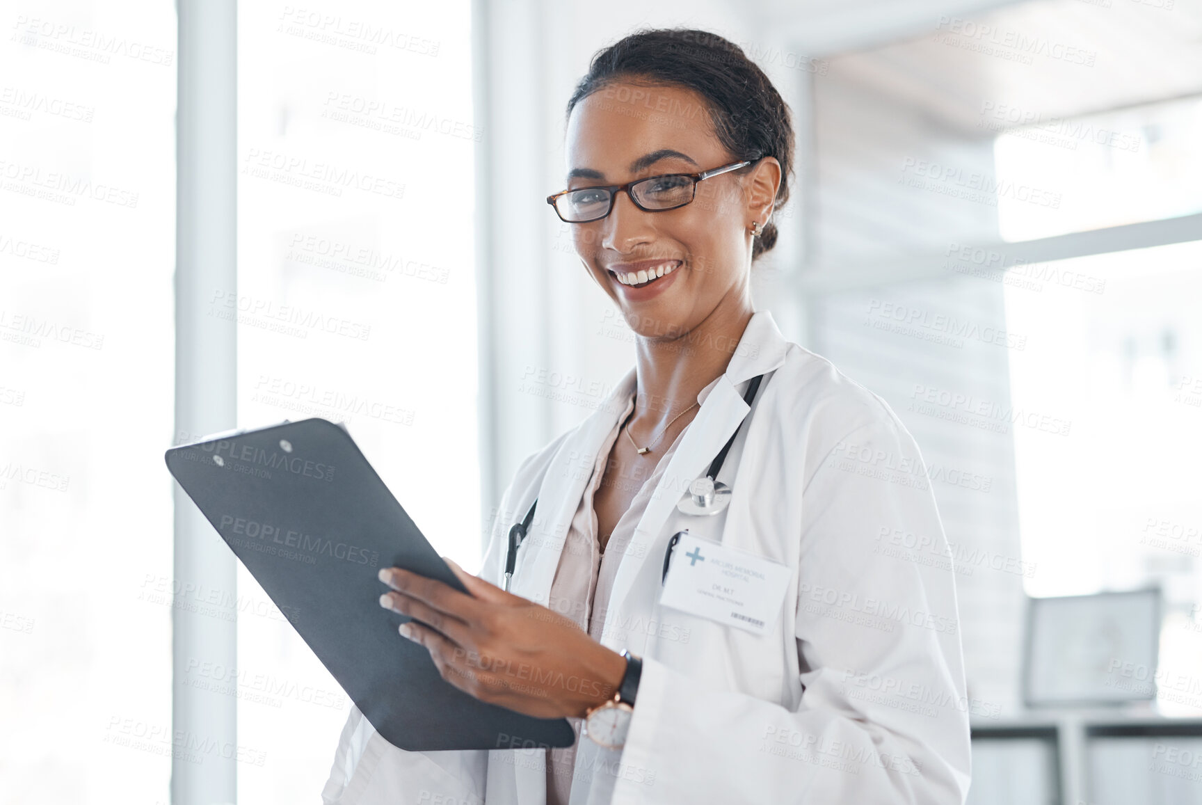 Buy stock photo Happy woman, portrait and doctor with clipboard for results, medical aid or insurance at hospital. Female person or healthcare employee with paperwork, documents or health forms for prescription