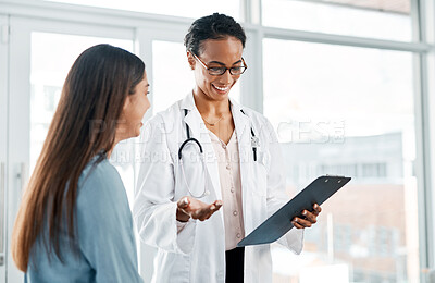 Buy stock photo Doctor, patient and happy in office for healthcare, medical diagnosis or clipboard with results. Oncologist, woman or notes in consultation for feedback, cancer free or excited for good news or trust