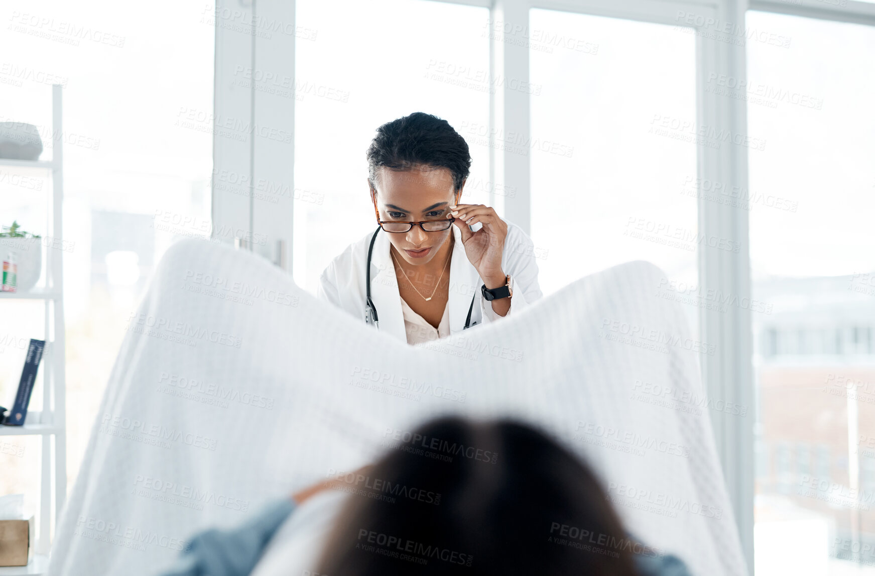 Buy stock photo Gynecology, doctor and woman with checkup at clinic for pelvic exam, pap smear and vaginal examination. Gynaecologist, patient and medical assessment, pregnancy planning and stirrups at hospital care