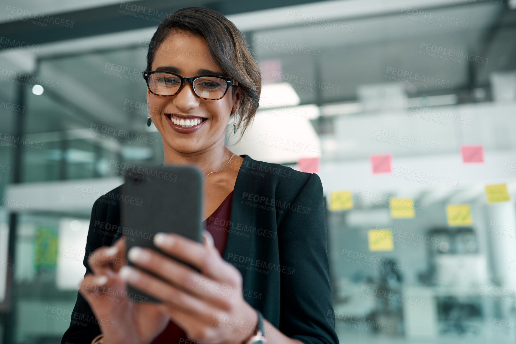 Buy stock photo Phone, smile and businesswoman in the office typing an email or networking on internet. Communication, technology and professional designer doing creative research on smartphone with sticky notes