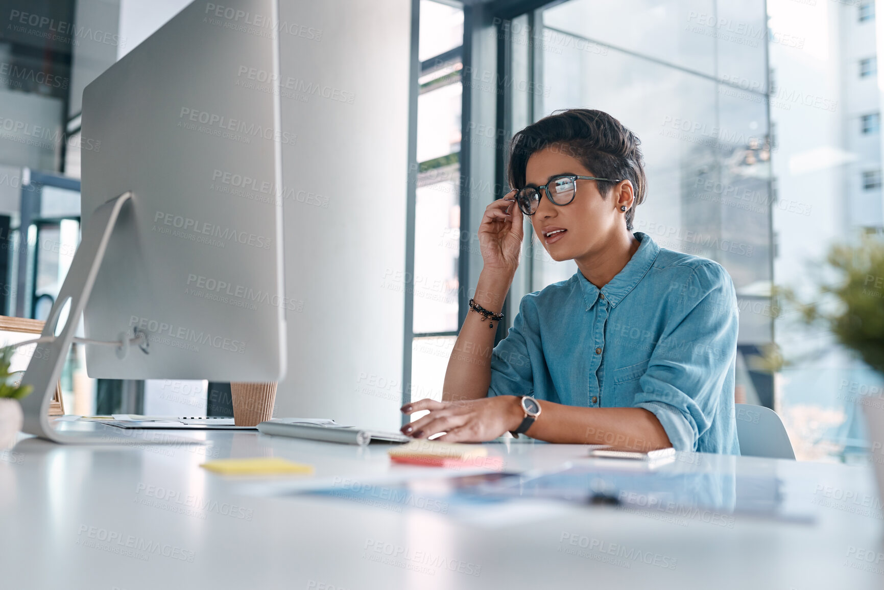 Buy stock photo Businesswoman, checking or reading on computer in office, report for career with website development. Female person, desktop or confused expression with glasses, creative designer with digital glitch