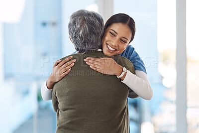 Buy stock photo Cropped shot of an attractive young female nurse embracing her senior patient