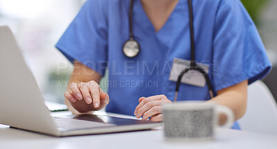 Buy stock photo Closeup shot of an unrecognisable doctor using a laptop in her office