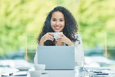 Buy stock photo Shot of a young businesswoman drinking a cup of coffee while sitting at her desk