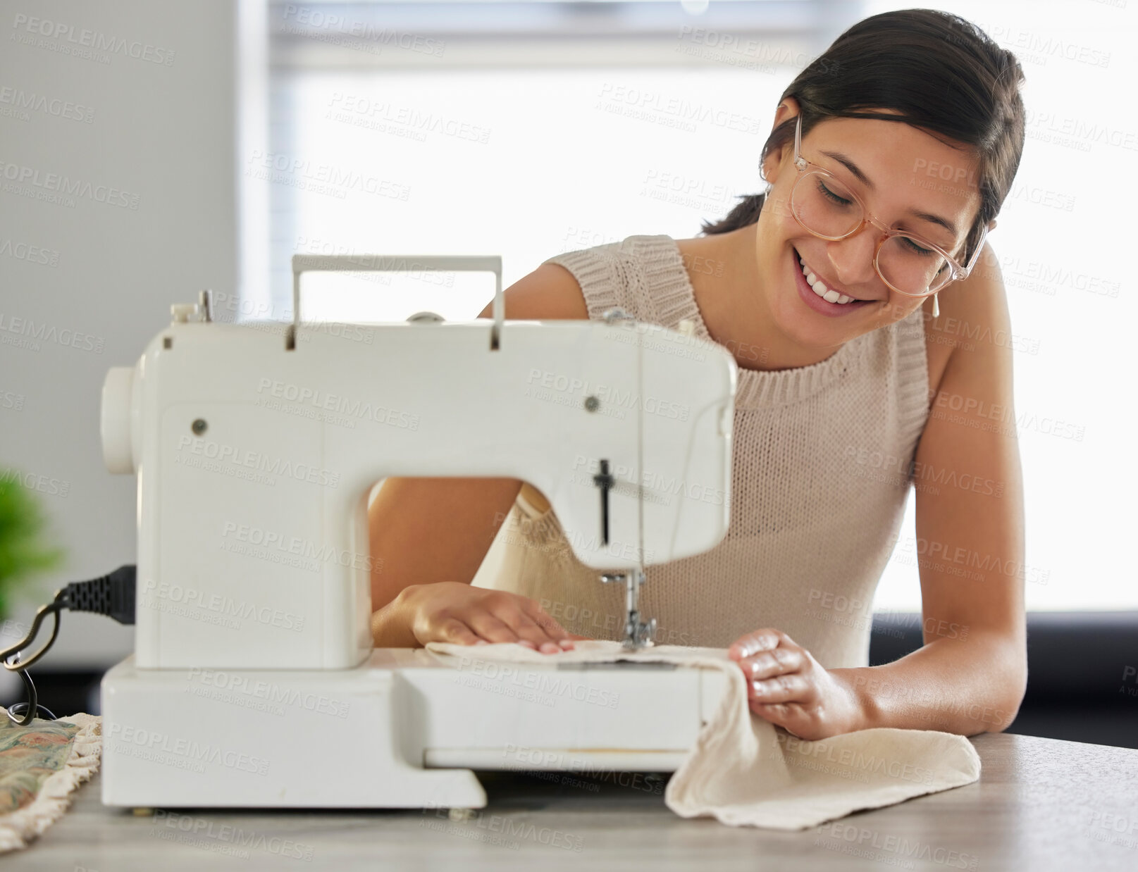 Buy stock photo Happy, woman and sewing machine in apartment for small business, fashion design and pride. Female seamstress, smile and fabric in home workshop for production, clothing and start up career in textile