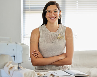 Buy stock photo Portrait of a young woman sitting with her arms crossed in her workshop