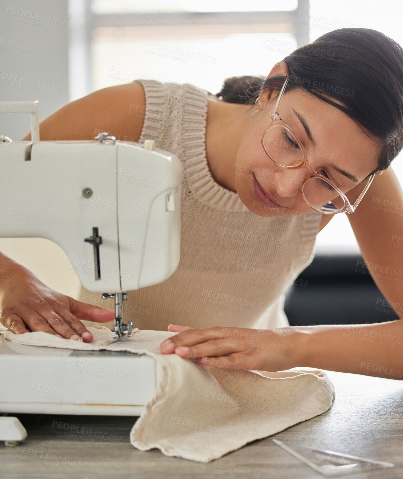 Buy stock photo Tailor, woman and sewing machine in apartment for small business, fashion design and pride. Female seamstress, smile and fabric in home workshop for production, clothing and textile for boutique 