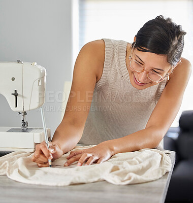 Buy stock photo Shot of a young woman designing a garment in her workshop