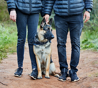 Buy stock photo Shot of a man spending quality time with his adorable german shepherd in the park