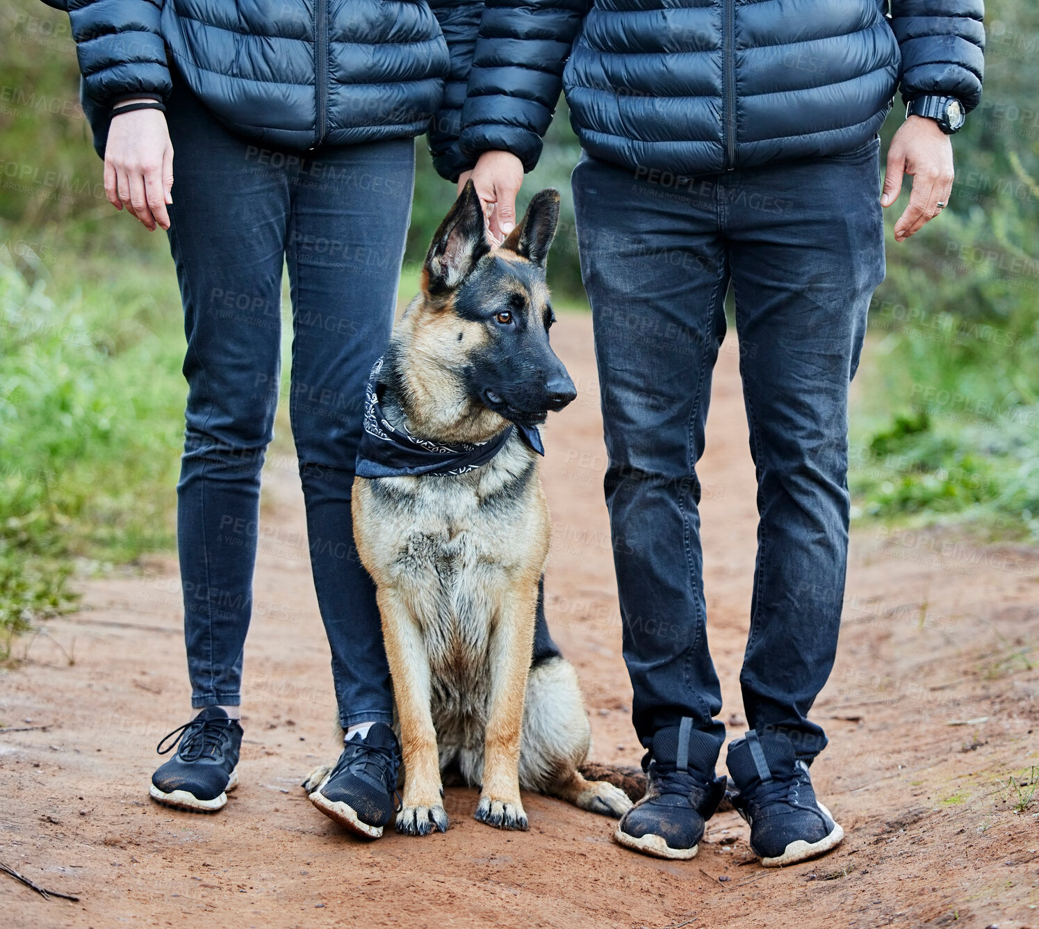 Buy stock photo Shot of a man spending quality time with his adorable german shepherd in the park