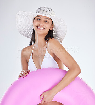 Buy stock photo Portrait, smile and woman with bikini, hat and toy for beach fun on white studio background. Face, person and model with happiness, cheerful and girl with vacation, holiday and joy with weekend break