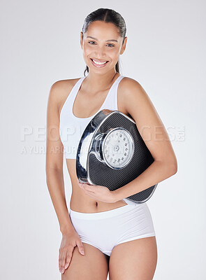 Buy stock photo Girl, portrait and scale in studio to measure, smile and excited for results of diet or detox. Female person, underwear and happy for calories burned target or goals, weight loss and white background