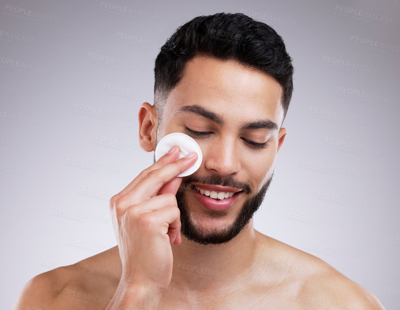 Buy stock photo Man, calm and studio for skincare with cotton for cleaning face in morning hygiene routine for wellness, grooming and self care. Person, eyes closed and isolated on white background for dermatology.