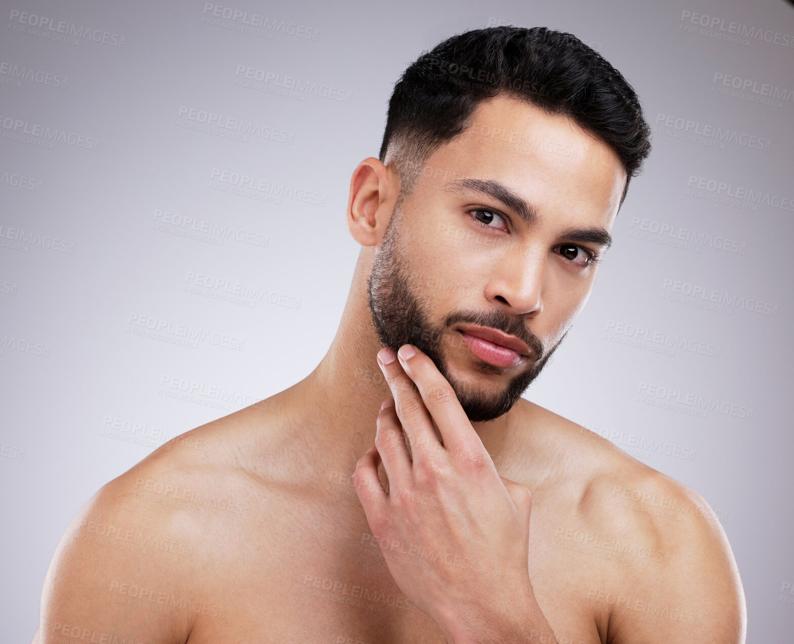 Buy stock photo Skincare, beauty and portrait of man in a studio with a natural, grooming and face routine. Self care, beard trim and male model with a dermatology facial treatment for clear skin by gray background.