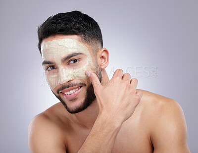 Buy stock photo Portrait, skincare or happy man with face mask for glow, detox or healthy pores for beauty in studio. White background, smile or model with cosmetics lotion for natural facial cream product treatment