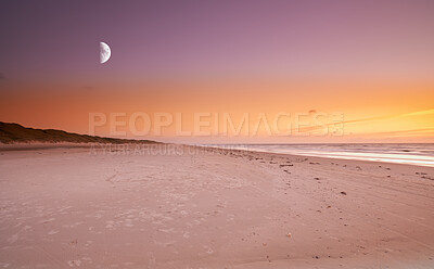 Buy stock photo Copy space at sea with moon in the twilight night sky and calm ocean waves across a relaxing beach shore. Scenic and peaceful panoramic of a beautiful sunset with lunar background and empty landscape