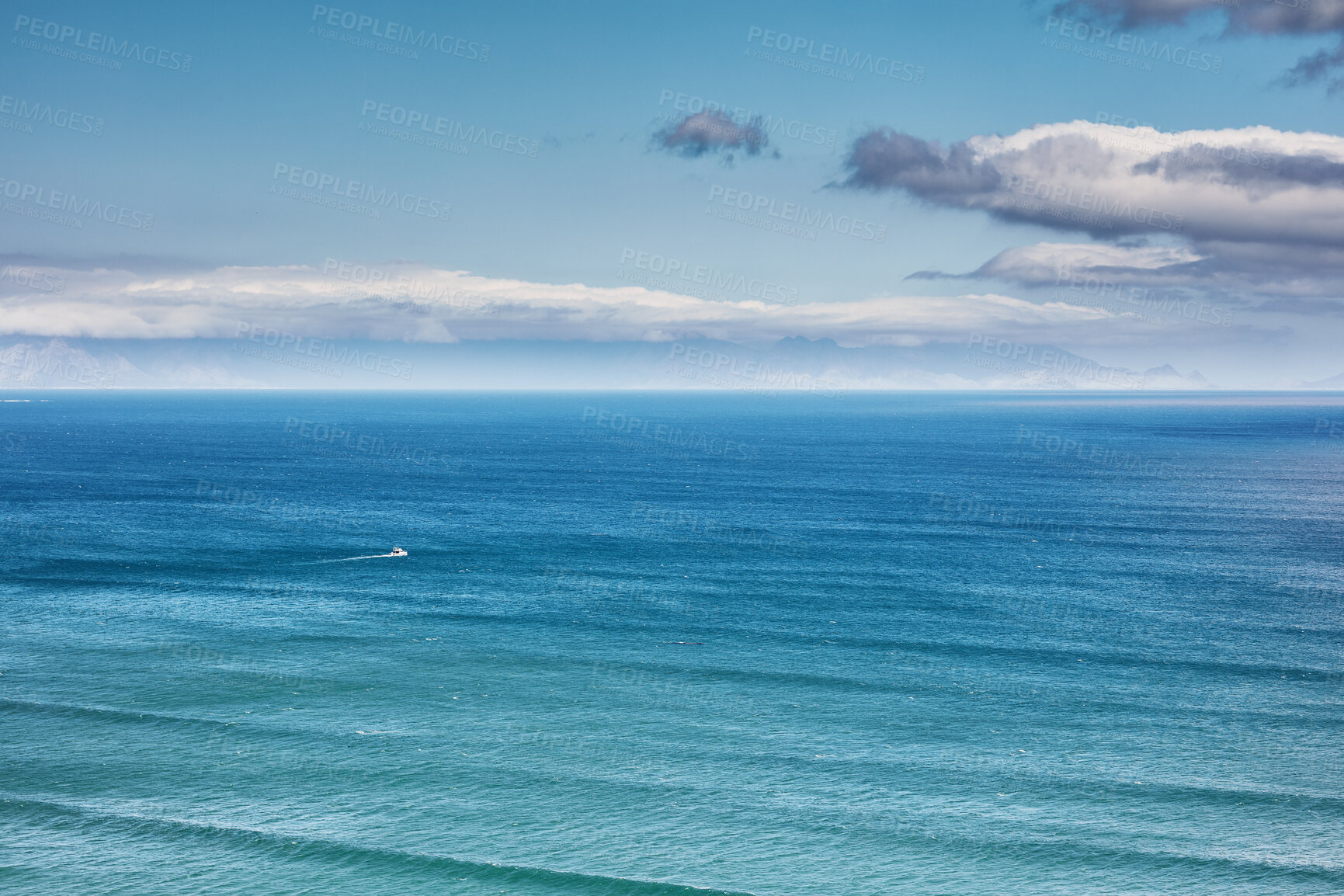 Buy stock photo Aerial, landscape, and copyspace view of the ocean and beach waves against a cloudy climate and blue sky in summer. Beautiful, scenic, and top view of the calm and relaxing sea on the coast in nature