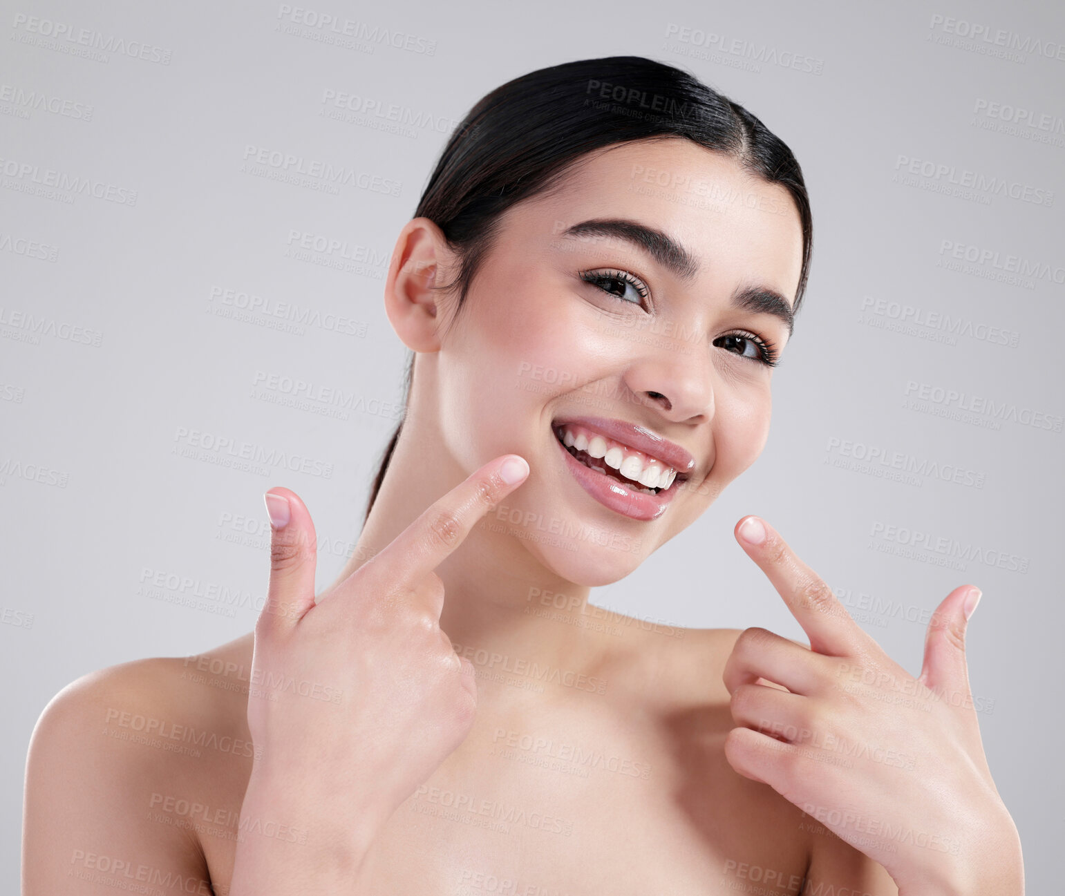 Buy stock photo Teeth, pointing and portrait of woman in studio for dental health, wellness and morning routine. Smile, beauty and female person with clean mouth for oral hygiene treatment by white background.