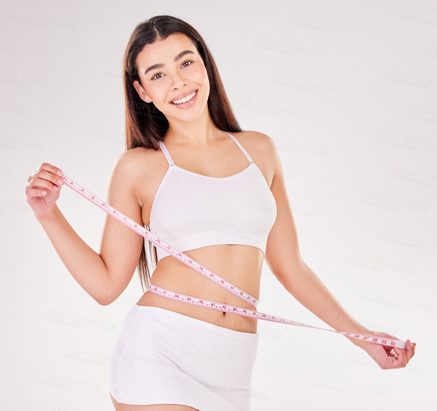 Buy stock photo Woman, portrait and smile with measuring tape in studio for weight loss, results and progress of diet. Person, underwear and happy with bmi in body care, wellness and health on white background