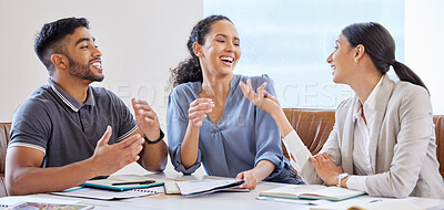 Buy stock photo Shot of a group of colleagues laughing in a meeting in a office