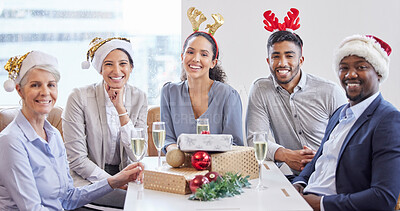 Buy stock photo Shot of a group of businesspeople celebrating together at their office Christmas party