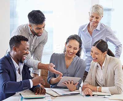 Buy stock photo Shot of a group of businesspeople brainstorming and exchanging ideas in a modern office
