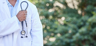 Buy stock photo Shot of an unrecognizable doctor standing in the city
