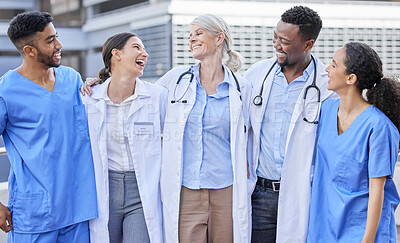 Buy stock photo Doctor team, city and laugh with hug and happiness from healthcare and wellness work. Hospital, nursing and happy clinic group with funny joke and support together by an urban building with a smile
