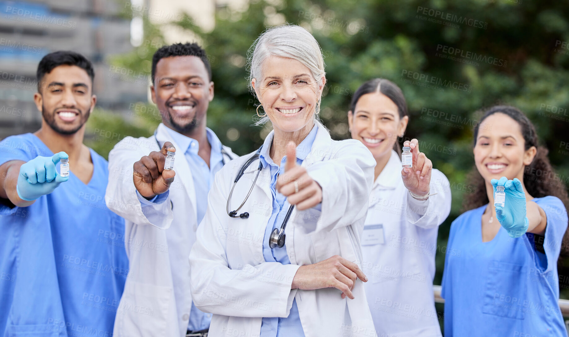 Buy stock photo Doctors, outdoor and thumbs up in portrait for vaccine, medicine and solidarity for healthcare. Collaboration, unity and teamwork or leadership for virus treatment, antibiotics and bottle for booster