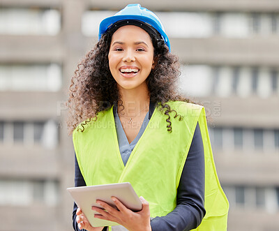 Buy stock photo Cropped portrait of an attractive young female engineer working on a tablet while standing on a construction site