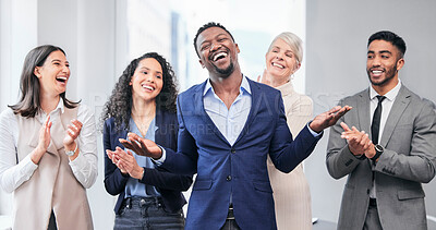 Buy stock photo Shot of a group of businesspeople applauding one of the colleagues