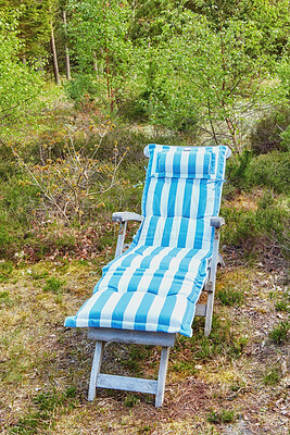 Buy stock photo Outdoor garden lounge chair for relaxing, enjoying nature views on camping trip in remote woods, forest or environmental nature reserve. Seating furniture in serene, peaceful and secluded countryside