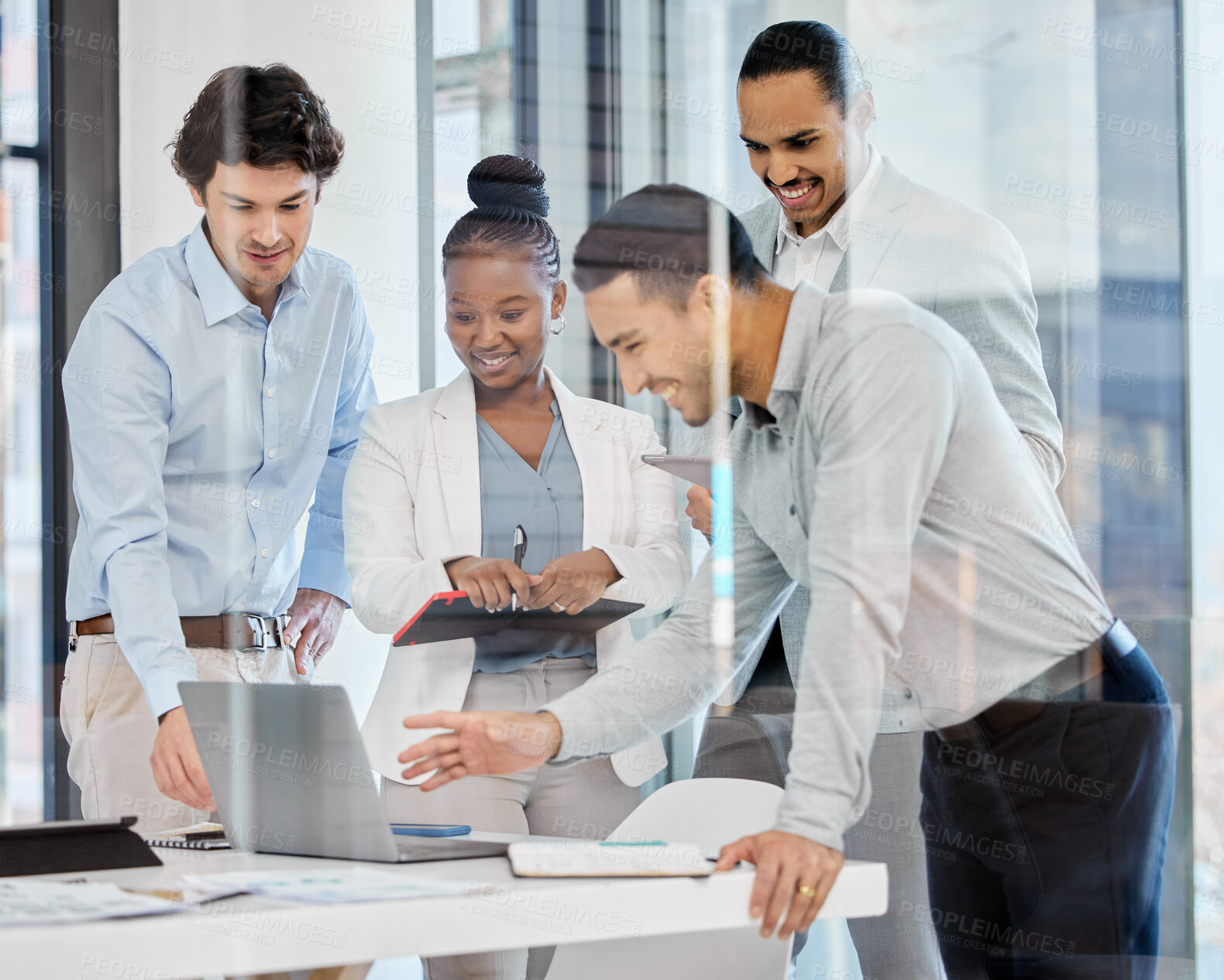 Buy stock photo Shot of a group of businesspeople brainstorming and exchanging ideas in a modern office