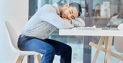 Buy stock photo Man, sleeping and tired at desk in startup with burnout, exhausted and overworked at creative agency. Employee, person and rest with fatigue, overtime and overwhelmed in modern office with nap at job