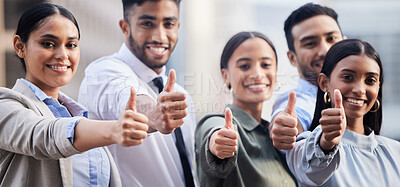 Buy stock photo Shot of a diverse group of businesspeople standing together and showing a thumbs up