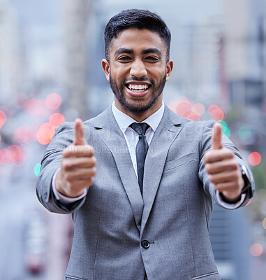 Buy stock photo Yes, portrait and businessman with thumbs up in a city for motivation, support or thank you gesture. Face, happy and Indian entrepreneur outdoor with winner, hands or travel agency service review