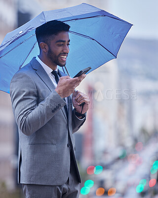Buy stock photo Speaker, phone call and businessman with umbrella in city for deal, negotiation or b2b client networking on winter commute. Hello, rain or smartphone app for translation, memo or travel assistance