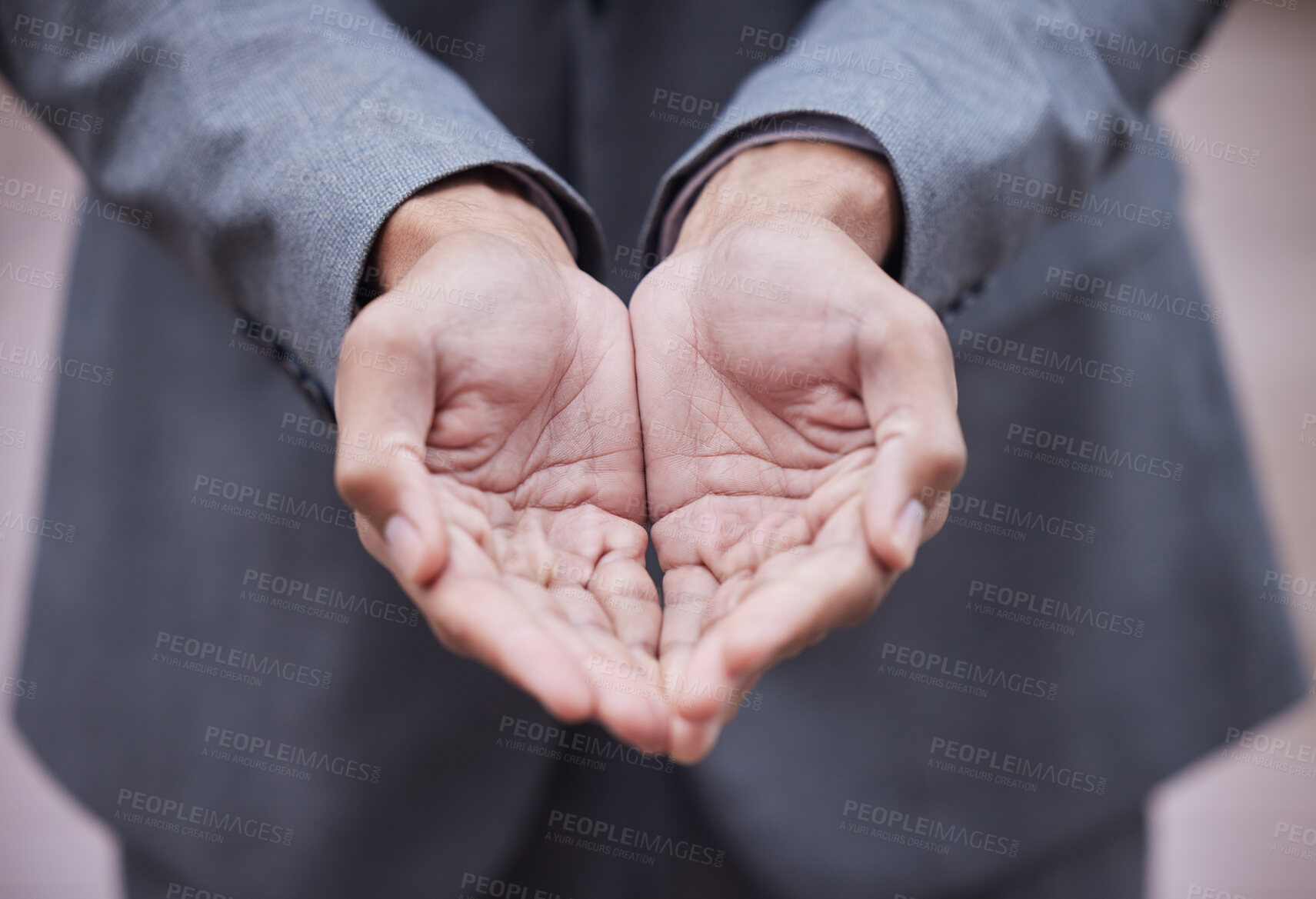 Buy stock photo Cropped shot of an unrecognisable businessman standing alone with his hands cupped